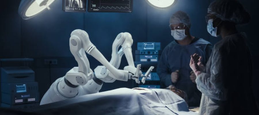 Two Surgeons Observing High-Precision Programmable Automated Robot Arms Operating Patient In High-Tech Hospital. Robotic Limbs Performing Complex Nanosurgery, Doctors Looking At Vitals On Monitor.